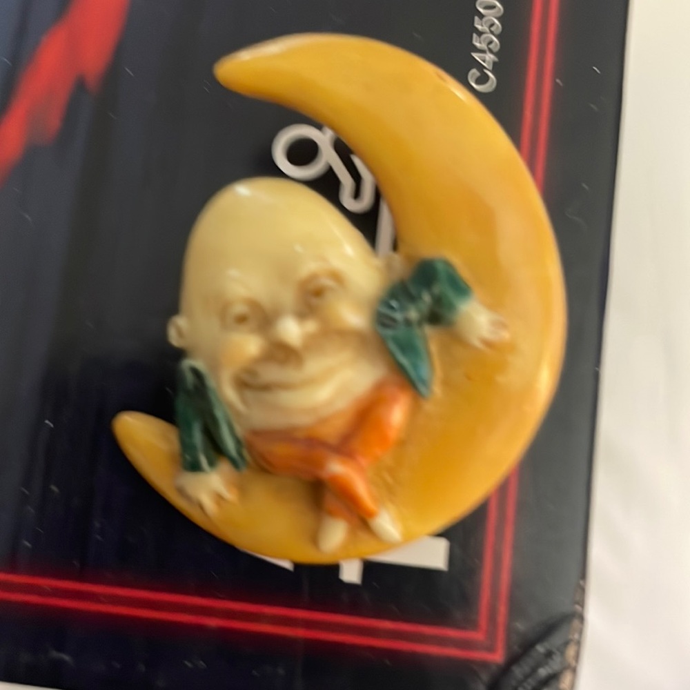 Man in the Moon pin.